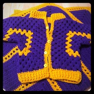 Purple and gold baby cardigan and blanket.